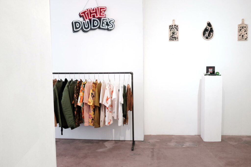 The Dudes brand corner at this year's Mosaic AW—24 Showroom in Berlin, including a hanging neon sign saying »The Dudes«