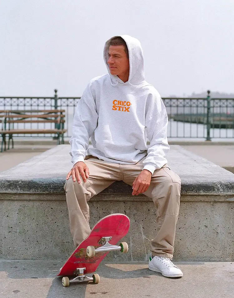 Professional skateboarder Chico Brenes sitting at Pier 7 manual pad in San Francisco