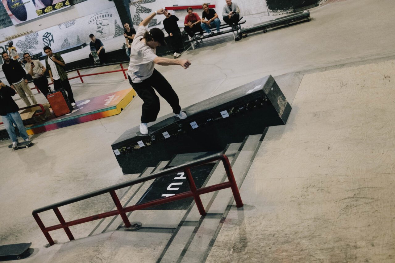 Photo showing skater Tim Janke performing a Backside 180 Fakie Nosegrind down the hubba at Skatehalle Berlin during HUF's "Forever" cash for tricks session.